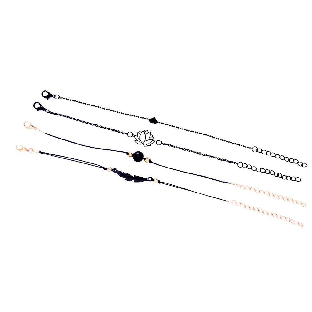 Set of four bracelets with different designs on a white background