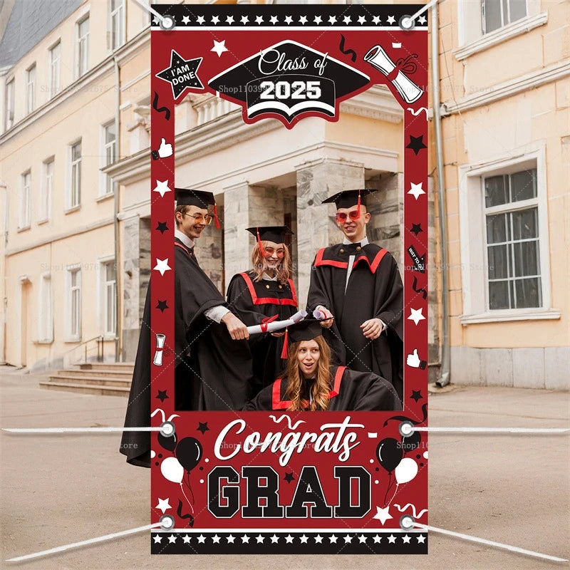 Graduation-themed photo frame with 'Class of 2025' and 'Congrats GRAD' text, used to take a photo of four graduates.
