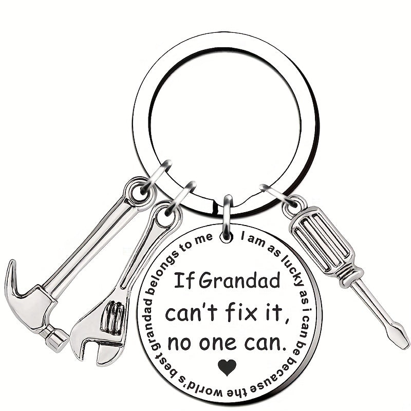 Keychain with tools and engraved message on a white background