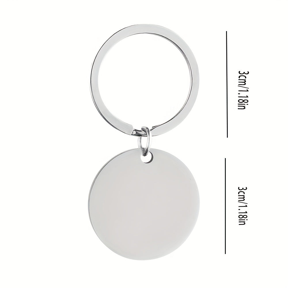 Silver keychain with a round pendant and measurements on a white background