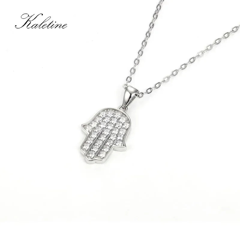 Silver Hamsa hand pendant necklace on a white background