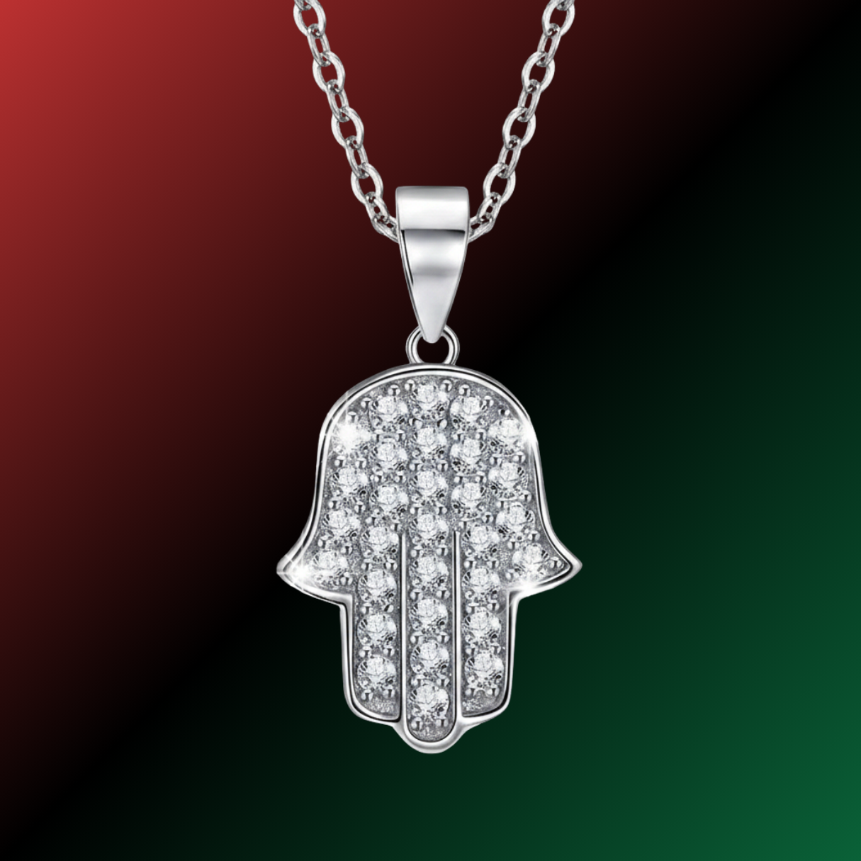 Silver Hamsa hand pendant necklace on a gradient red to green background
