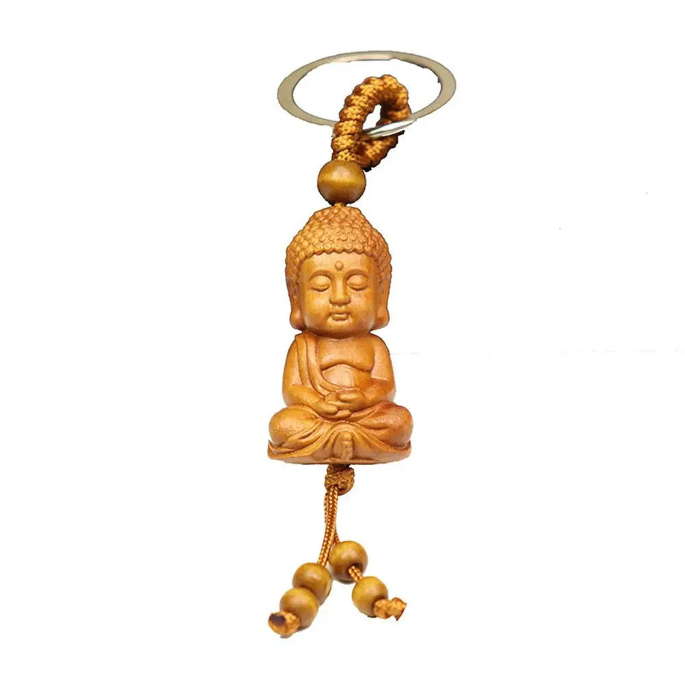 Hand-carved wooden Buddha keychains with prayer and meditation poses