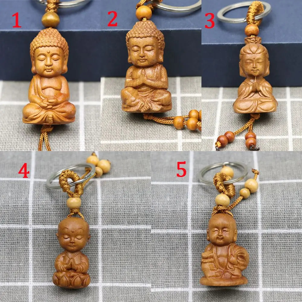 Hand-carved wooden Buddha keychains with prayer and meditation poses