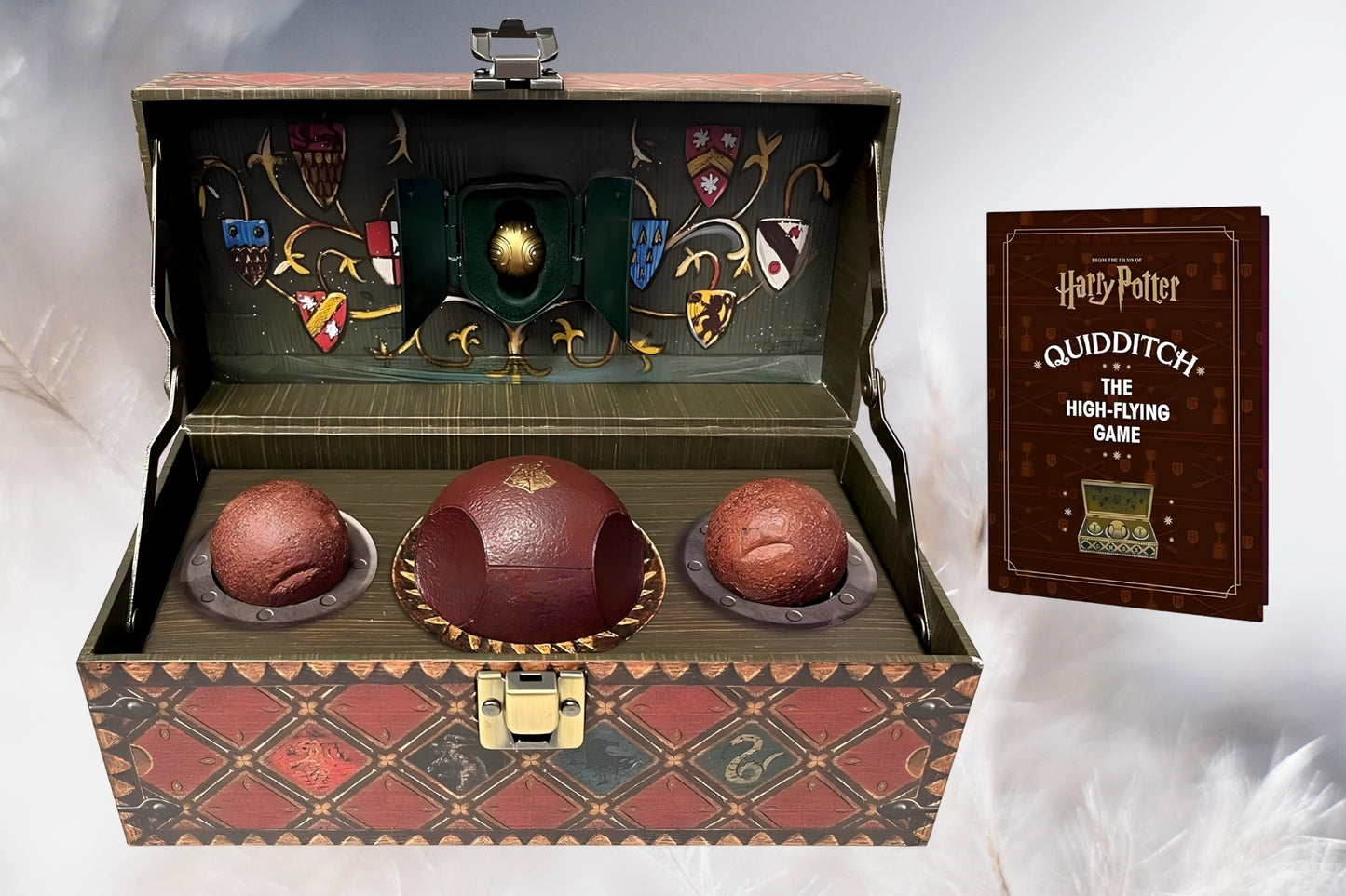 Decorative box with 'Harry Potter' Quidditch-themed items on a white background