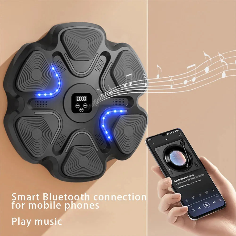 Haymaker Boxing-Music Playmaker: Bluetooth Strike Target W/ Music Mounted Punch Pad displayed next to someone holding a phone, displaying the exercise machine's ability to double as a music player.