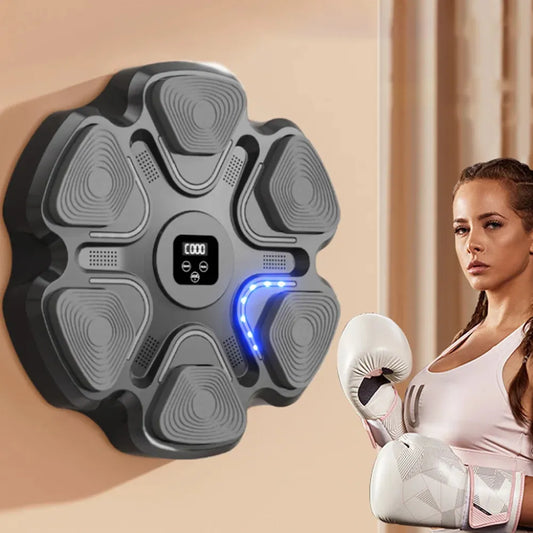 A woman is pictured with boxing gloves on, in front of a wall-mounted boxing machine with a blue light strip. The machine is black with a digital display in the center.