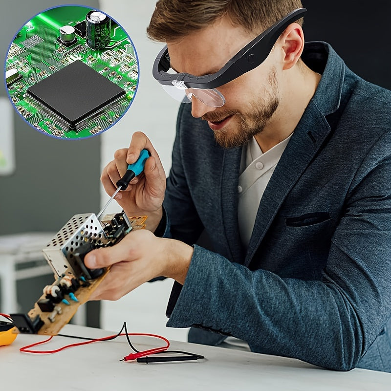 Man wearing head light magnifying glass wearable while working on electronic components with a close-up of a circuit board.