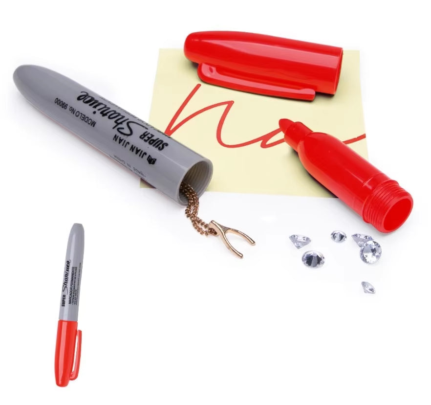 Hollowed out red permanent marker with screw off cap for storing valuables.