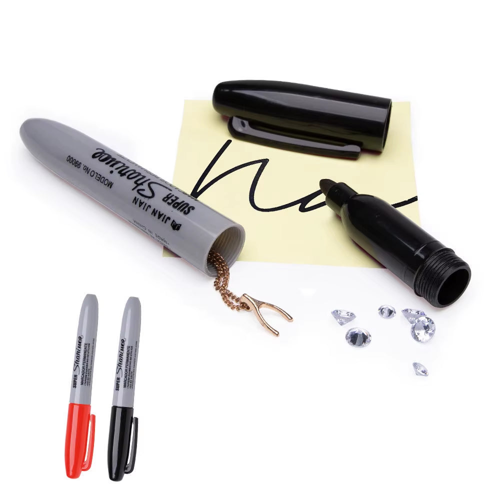 A hollowed-out permanent marker decoy with a few valuables items placed inside, such as a red pen and some crumpled paper with a diamond-like pattern.