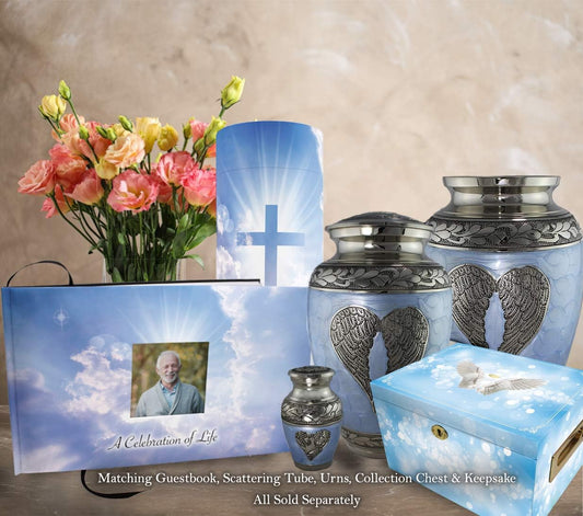 Display of book 'Holy Heavens Dearly Departed Photo Funeral Guestbook Attendance Log' featuring the book with "Celebration of Life" on the cover and the funeral guest attendance guestbook in front of a vase of flowers and next to matching candles, urns, box and decorations.