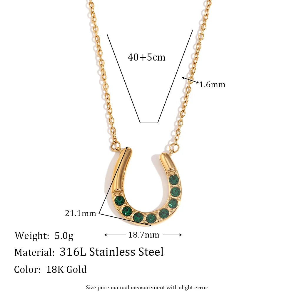 Gold necklace with green gemstones, showing measurements and material details on a white background.
