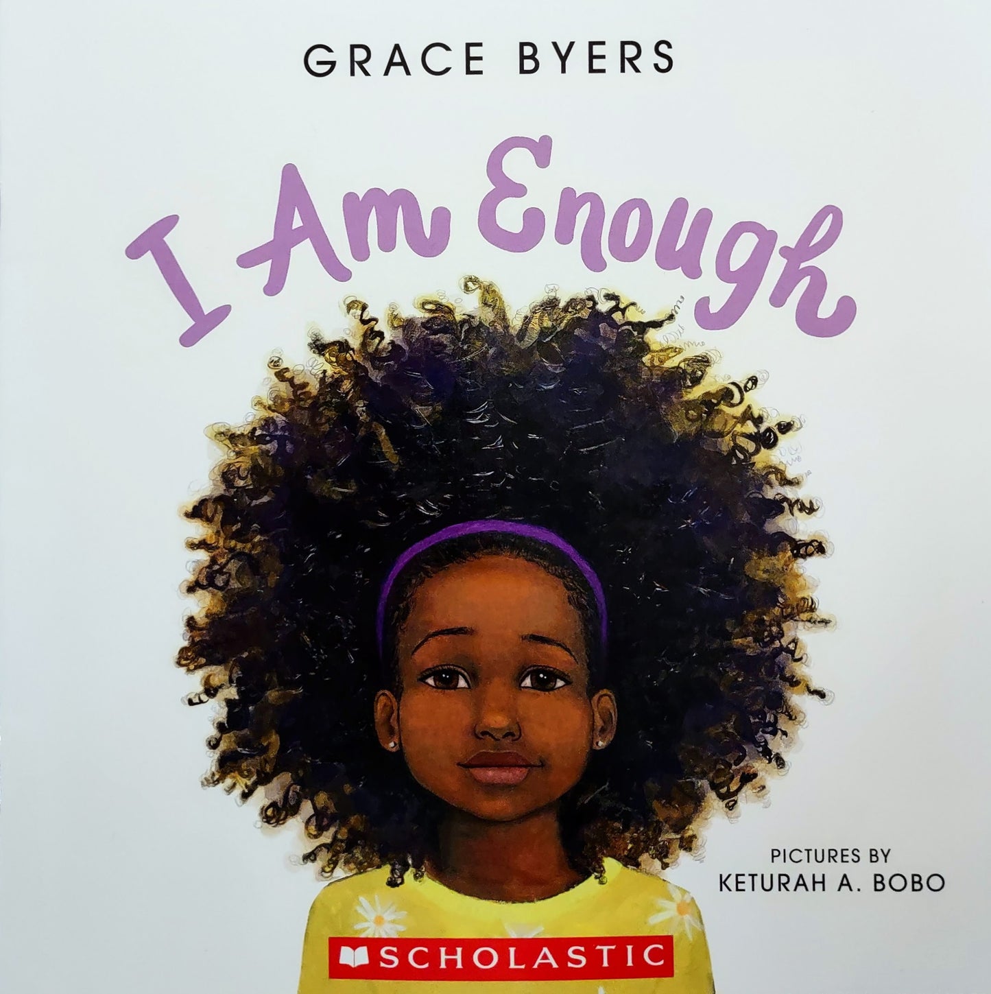 Book cover of 'I Am Enough' by Grace Byers with a young girl's face on a white background.