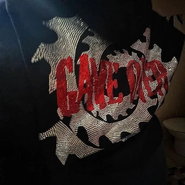 Jigsaw hoodie full-zip mask from Saw with rhinestone graphics and horror design and Back of hoodie with Game Over buzzsaw design from Saw movie franchise