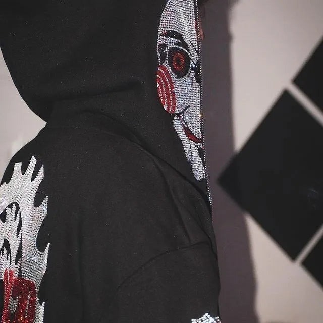 Jigsaw hoodie full-zip mask from Saw with rhinestone graphics and horror design and Back of hoodie with Game Over buzzsaw design from Saw movie franchise