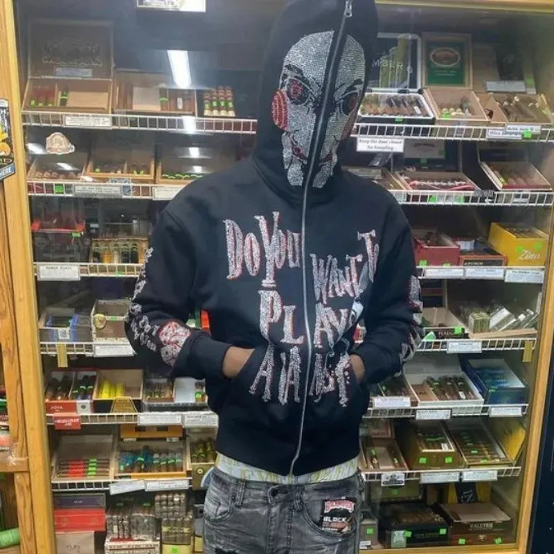 Jigsaw hoodie full-zip mask from Saw with rhinestone graphics and horror design and Back of hoodie with Game Over buzzsaw design from Saw movie franchise