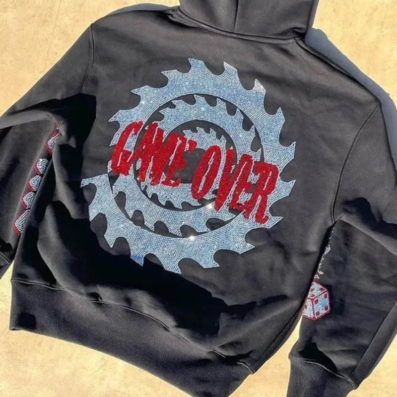 Jigsaw hoodie full-zip mask from Saw with rhinestone graphics and horror design and Back of hoodie with Game Over buzzsaw design from Saw movie franchise