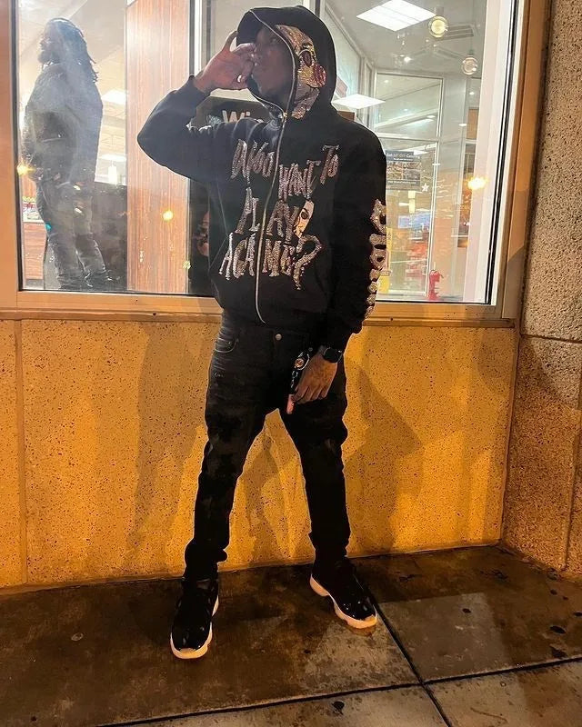 Jigsaw hoodie full-zip mask from Saw with rhinestone graphics and horror design and Back of hoodie with Game Over buzzsaw design from Saw movie franchise