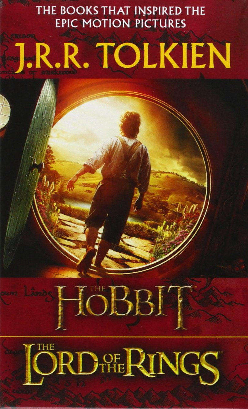 Book front cover of 'The Hobbit' from the "J.R.R. Tolkien Middle-Earth Legendarium (4) Book Boxed Set" featuring an image of someone with their back turned and walking through a circular door into the sunshine, with a mountainous landscape.