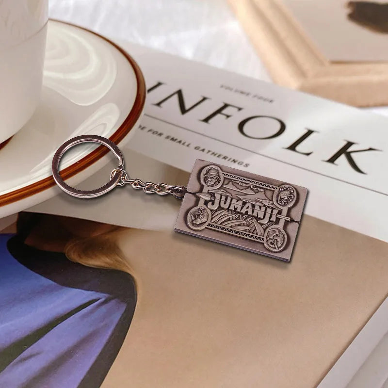Jumanji keychain with decorative design on a magazine