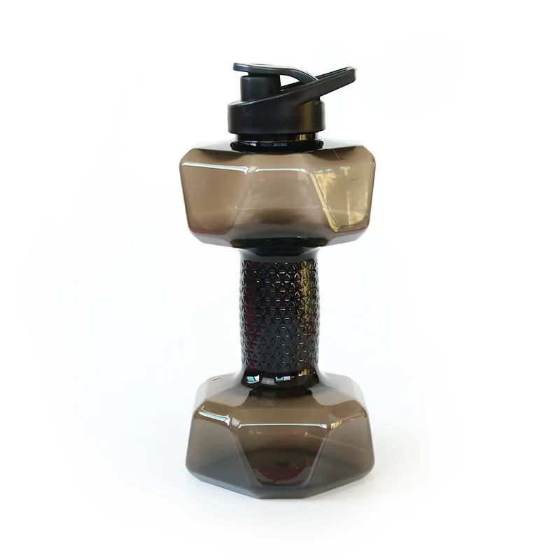 Transparent dumbbell water bottle with black cap on a white background