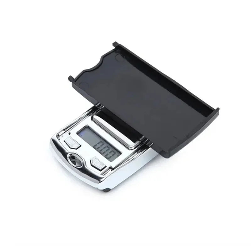 Digital pocket scale with a black lid on a white background