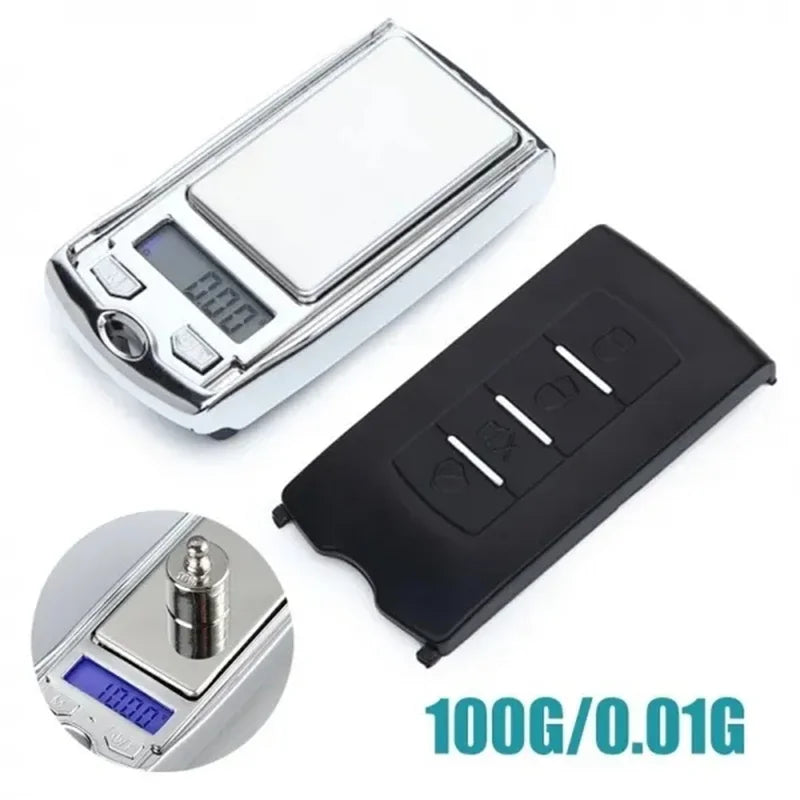 Digital pocket scale with black remote control on a white background