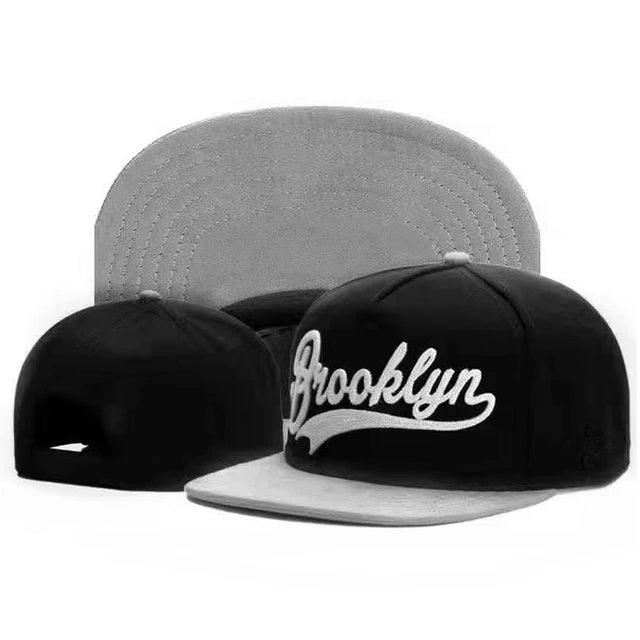 Black cap with 'Brooklyn' text on a white background