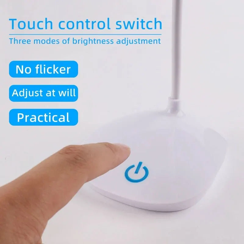 Hand pressing a touch control switch on a lamp with text about brightness adjustment modes.