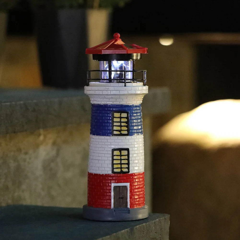 Model lighthouse with red, white, and blue colors on a blurred background