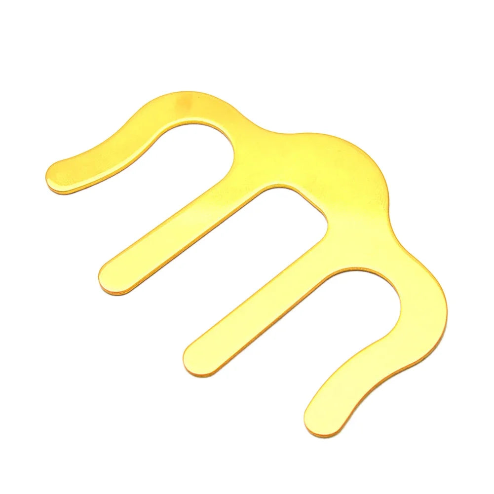 Gold M-type book music sheet page clamp holder in elegant fashion presented over contrasting white background.