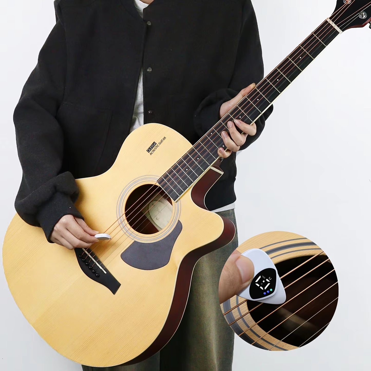 Guitarist using the Magic Pick to tune an acoustic guitar instantly while playing.