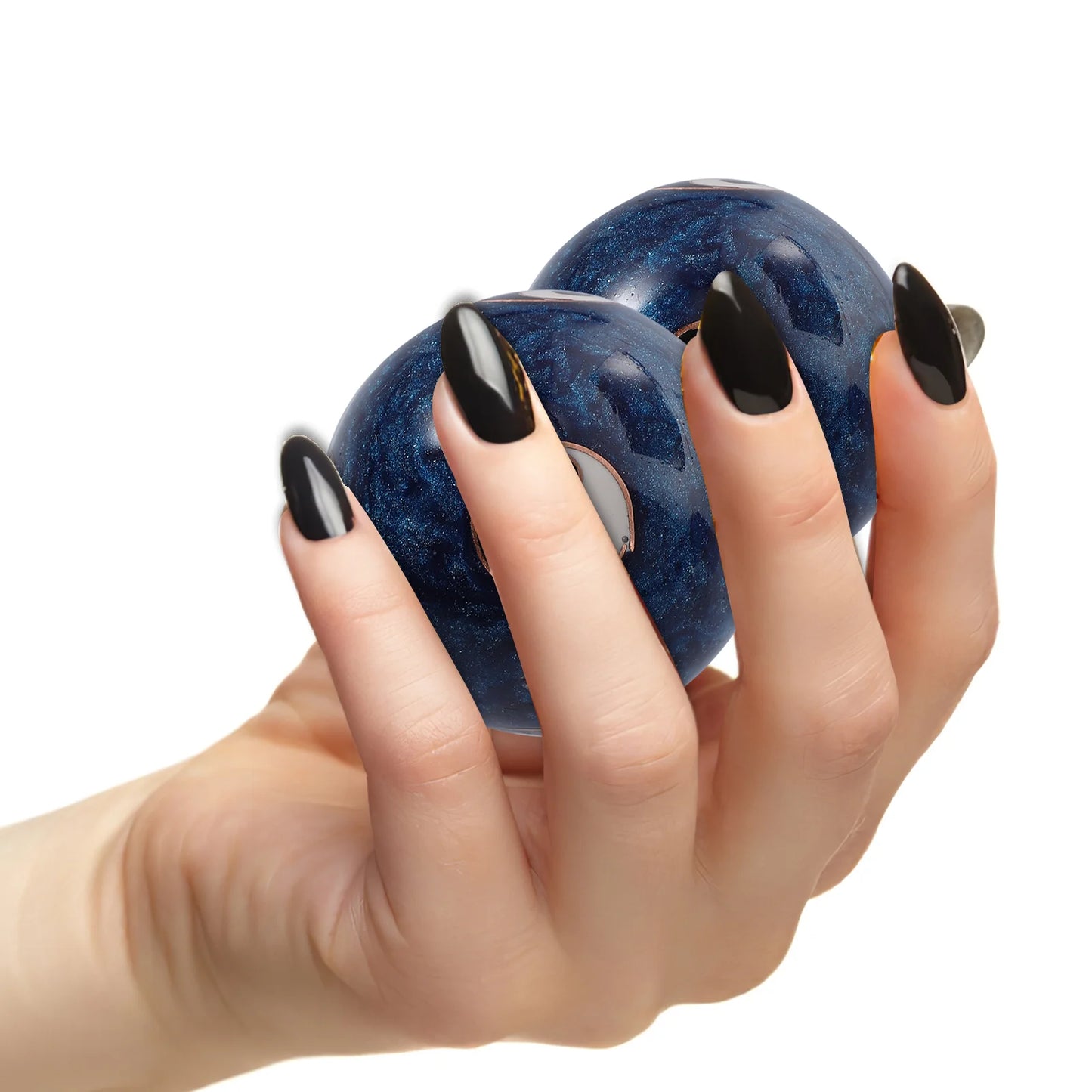 Hand holding two Meditation Baoding Balls.