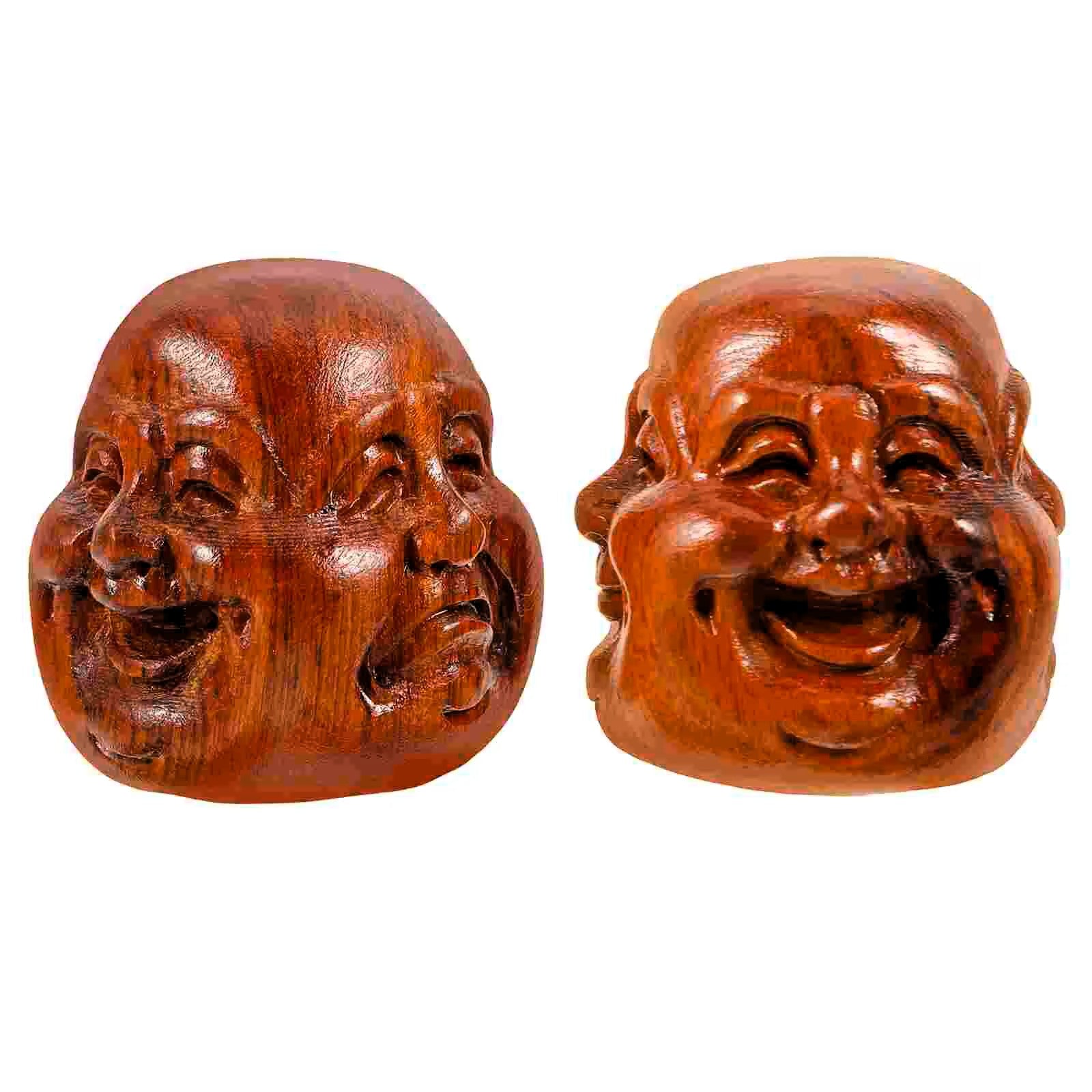 Two small carved wooden laughing Buddha baoding balls shown side by side on a plain white background.