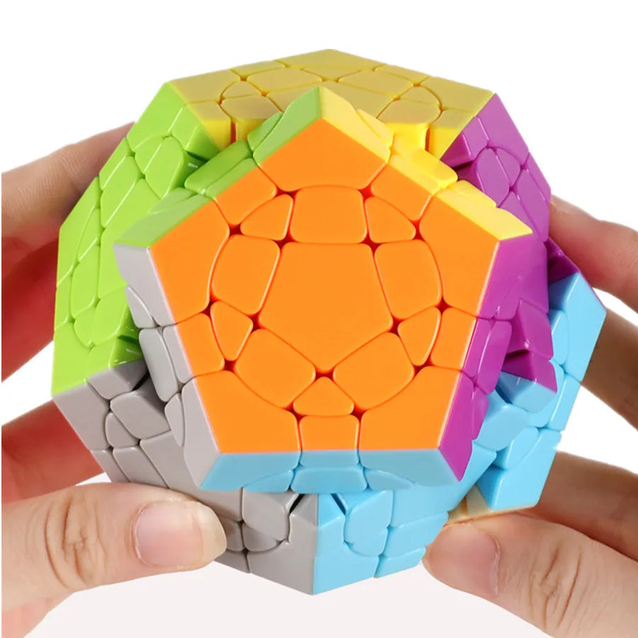 Colorful geometric puzzle held by a hand on a white background