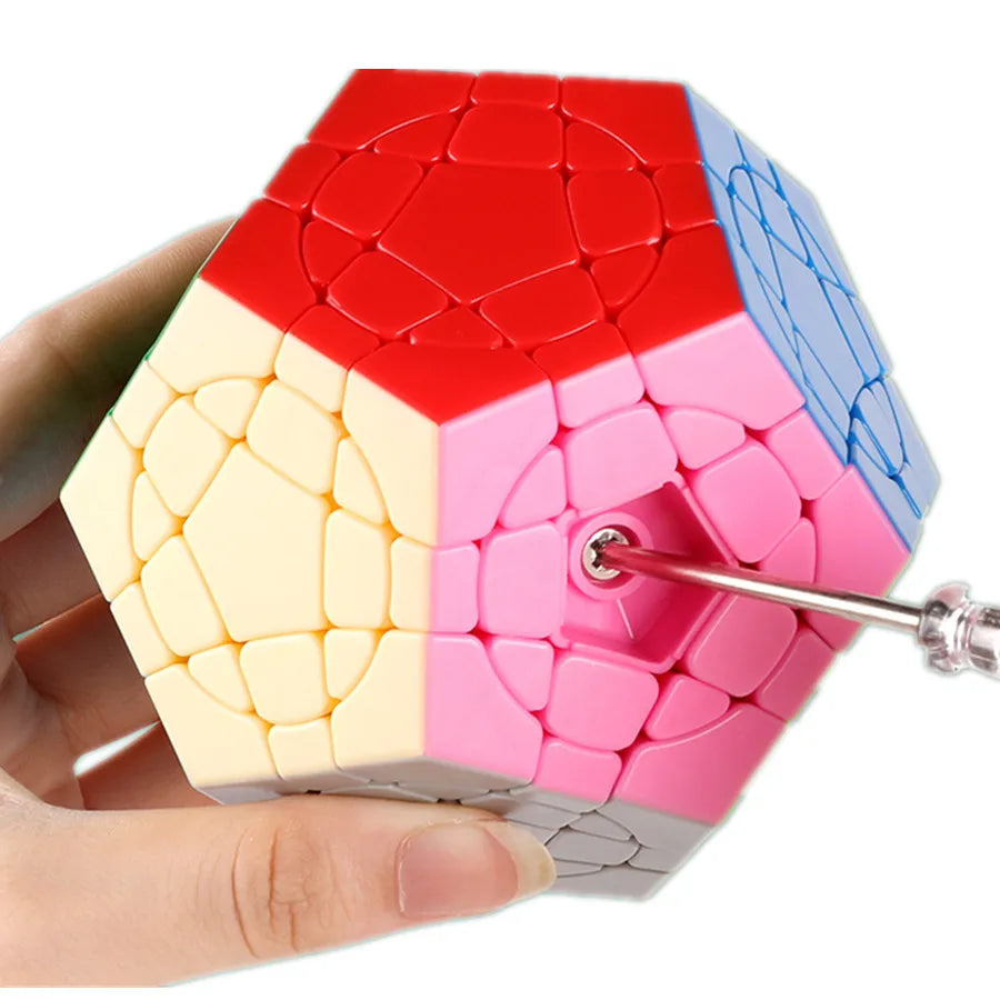 Dodecahedron puzzle with colorful faces held by a hand on a white background