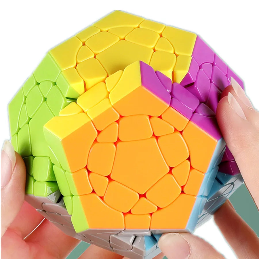 Colorful geometric puzzle being held by hands on a white background
