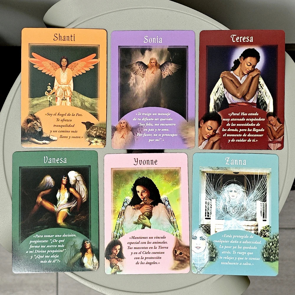Set of tarot cards with angelic imagery and names on a circular gray surface.