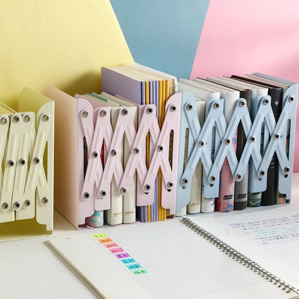 Colorful bookends on a desk with books and a notebook.