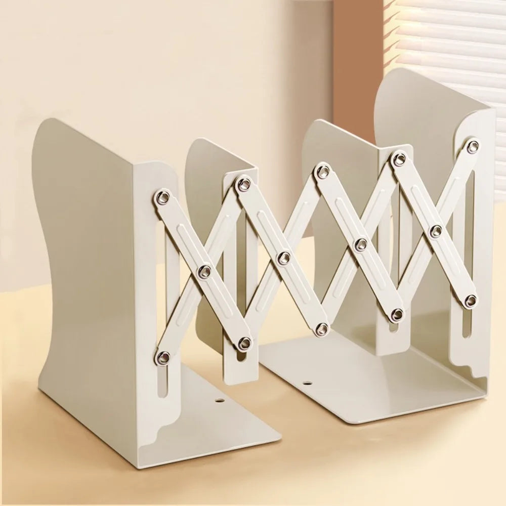 Off-white metal bookends expanded on a beige background
