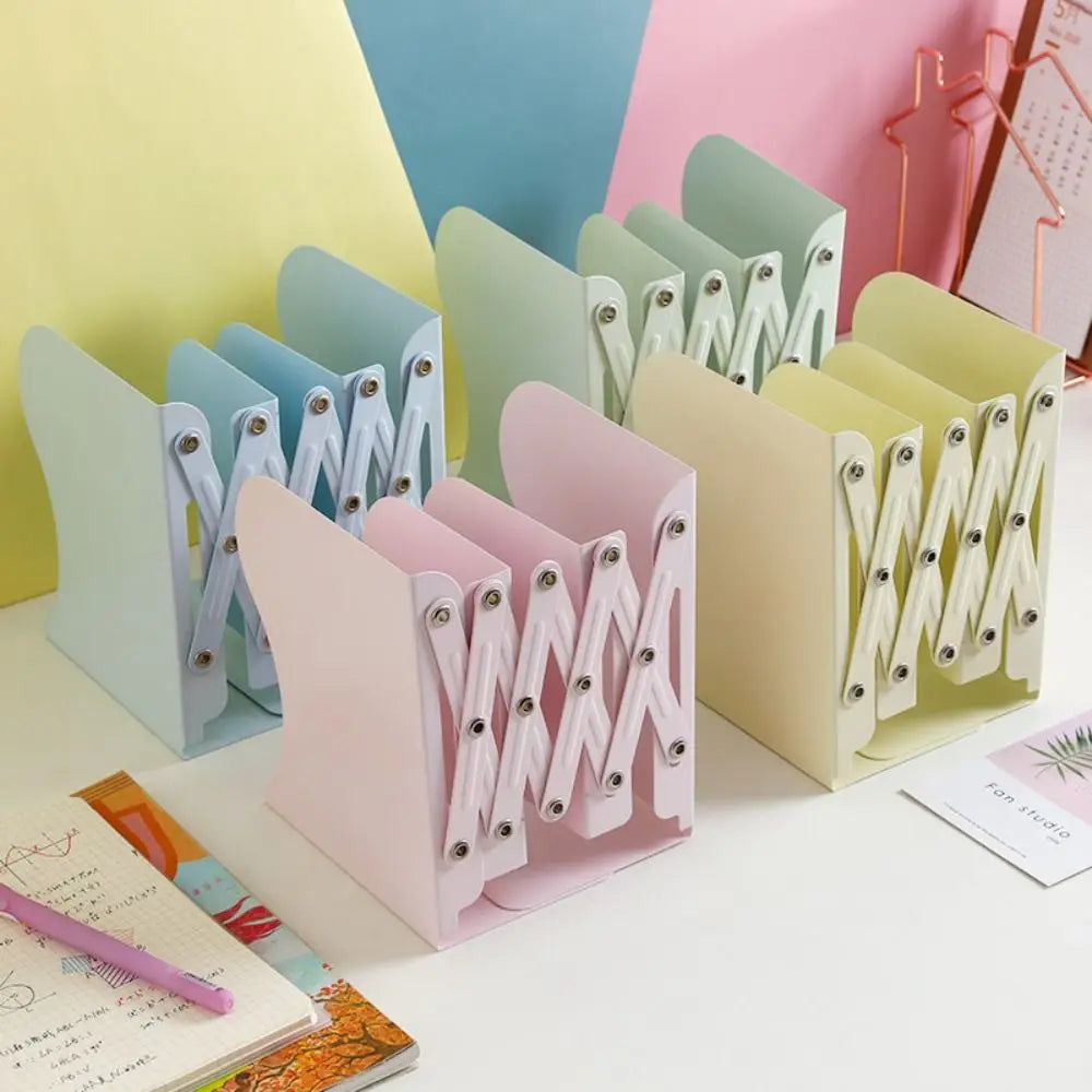 Pastel-colored metal bookends on a white surface with a colorful background