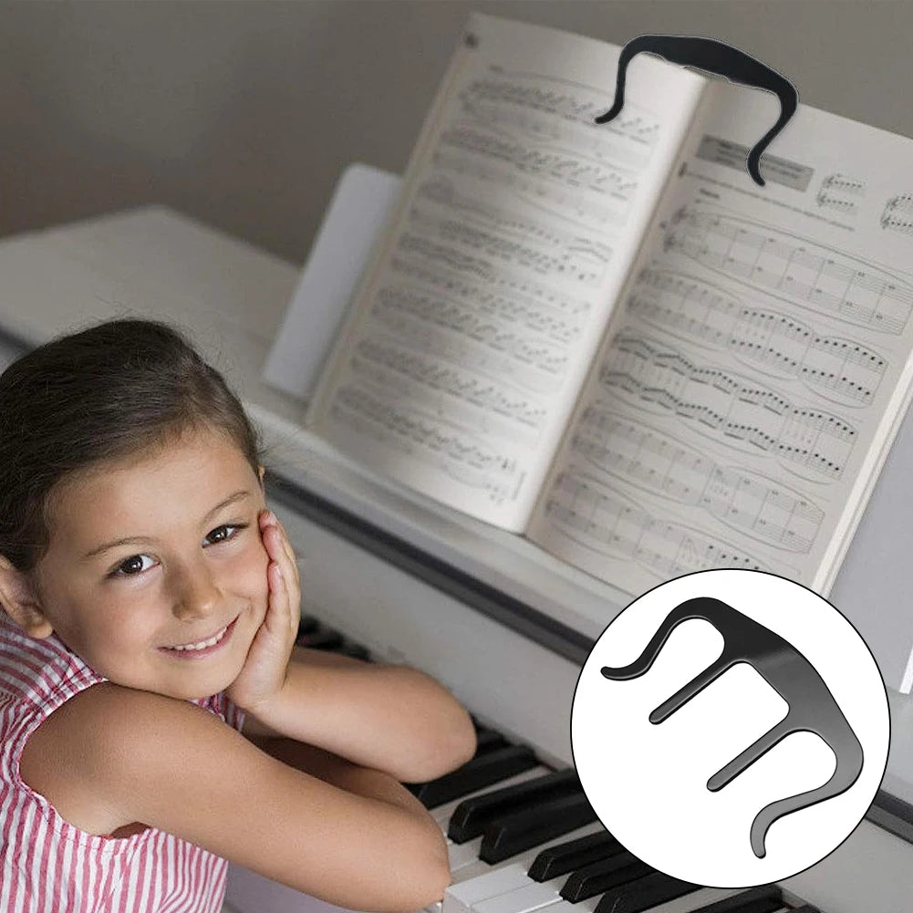 Young girl sitting at a piano with sheet music, featuring a music stand clip inset.