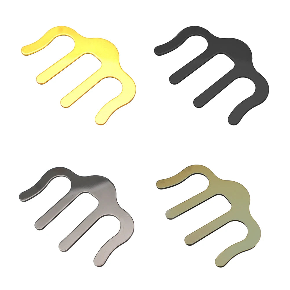 Four metal hair clips in different colors on a white background