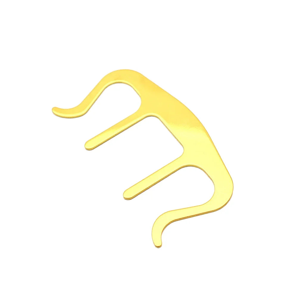 Gold-colored sheet music book page holder over a white background