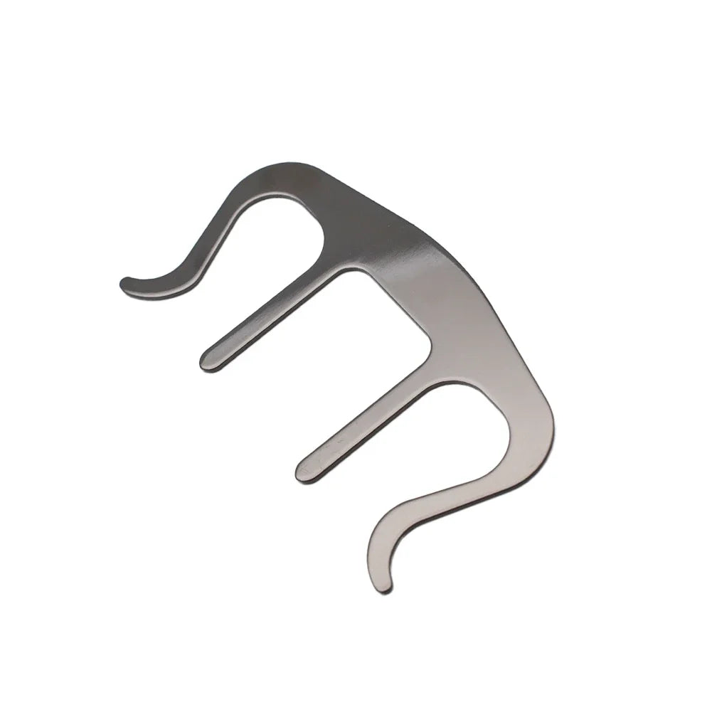 Metallic book clip / sheet music clamp on a white background