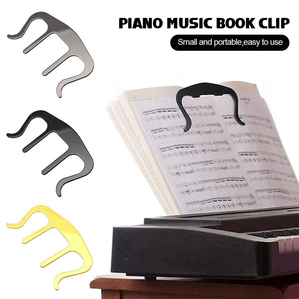Piano music book clip with three color options displayed on a piano.