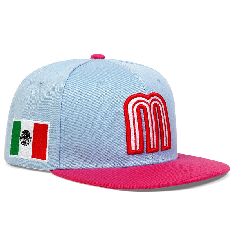 Mexico baseball hat snapback cap with 'M' logo and Mexican flag in sky glue with flat pink brim - angle view.