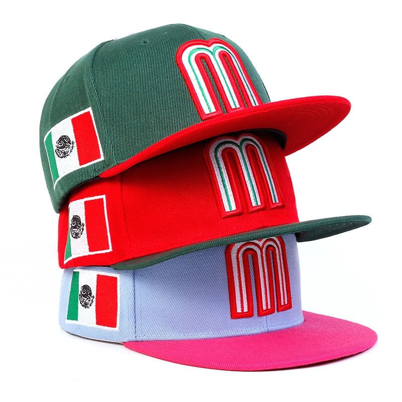 Mexico baseball hat snapback caps with 'M' logo and Mexican flag, assorted colors stacked.