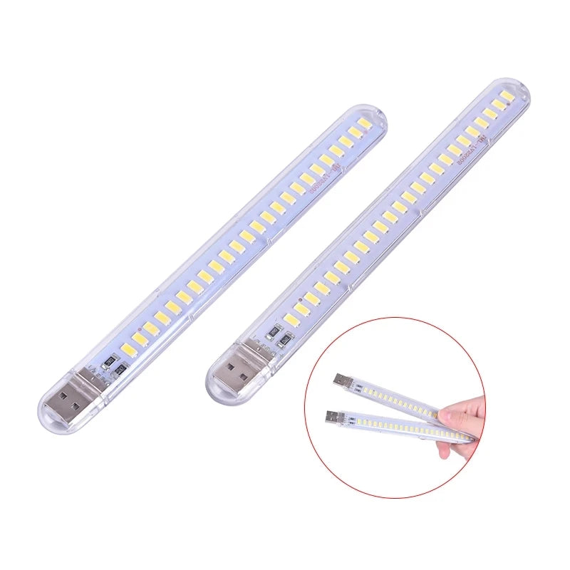 Two USB LED lights on a white background with an inset showing a hand holding one of the lights.