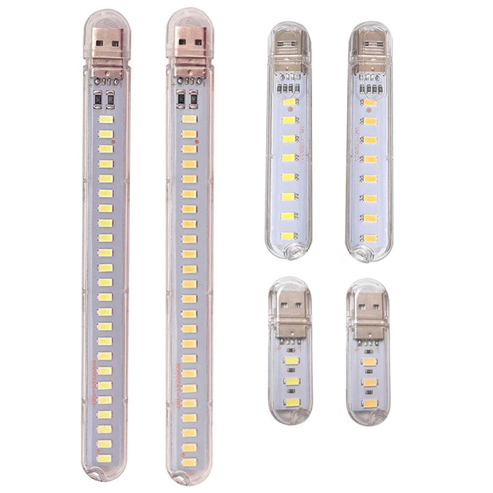Set of five USB LED light sticks on a white background